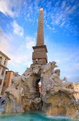 Fototapeta na wymiar Urban view of Rome, Italy: Fountain of the Four Rivers (Fontana dei Quattro Fiumi) with an Egyptian obelisk in Navon Square (Piazza Navona). 
