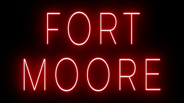 Flickering red retro style neon sign glowing against a black background for FORT MOORE