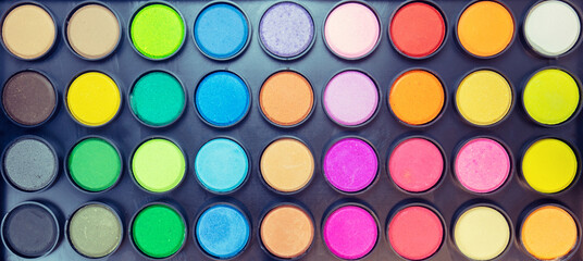 Box with watercolor paints. Set of multi-colored watercolor paints.