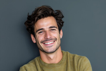 Fototapeta premium A man with a beard is smiling for the camera