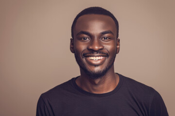 Fototapeta premium A man in a black shirt smiles for the camera