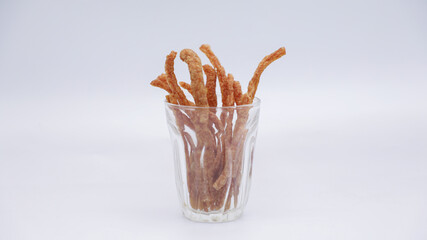 Fried pork is made into sticks as snacks.