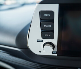 Hand operating switch on the car, car interior button, Interior of the car with cruise control...