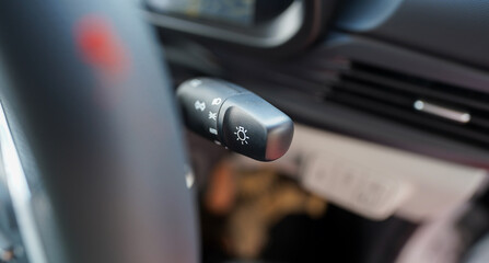 Hand operating switch on the car, car interior button, Interior of the car with cruise control buttons, Hyundai i20: 5 Features stock images