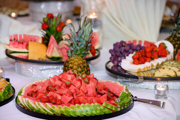 Fototapeta na wymiar Wedding catering table with various fruits, with watermelon in front