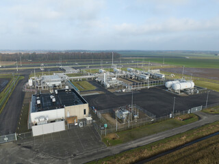 Natural gas fields near Groningen causing earthquakes, Mining of natural resources industrial installation. Birds eye aerial drone view.