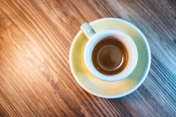 fresh tasty cup of espresso or americano coffee on the table in cafe