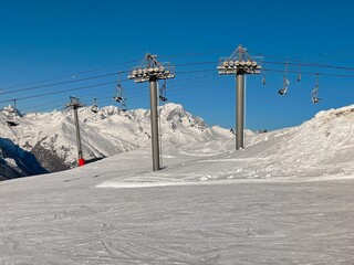 ski lift in beautiful snowy mountains in a ski resort in Tarentaise france
