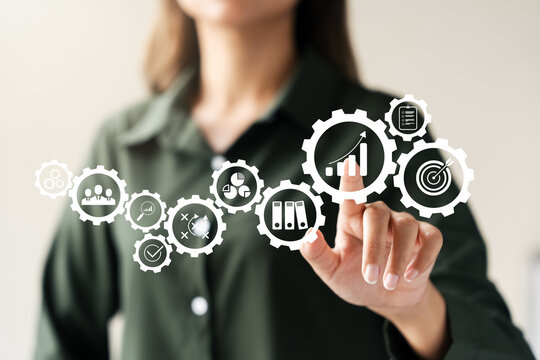 Businesswoman touching icon achieve excellence in business operations, strategic workflow management Our high performance solutions drive success through quality control and problem solving.