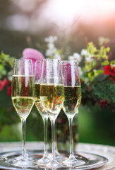 Champagne glasses on silver tray