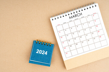 March 2024 desk calendar on brown color background, position with copy space.