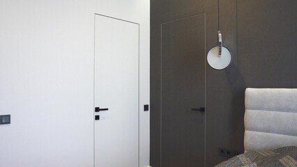 Interior design stylish modern hidden installation doors of different colors on two white and dark...