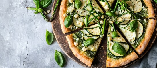 Green pizza with cauliflower, spinach, zucchini, and asparagus.