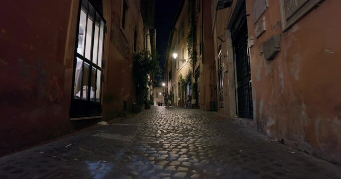 Rome Italy night street cityscape. Urban landscape of city lanterns, old houses in the historical center of evening tourist walks. High quality 4k footage
