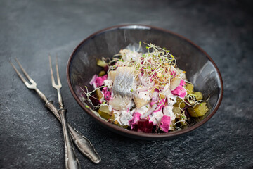 herring salad with baked beets and pickled cucumbe
