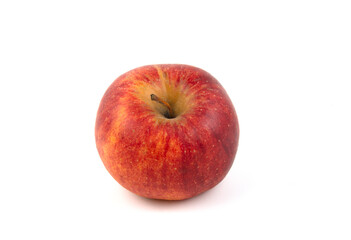 Red apple isolated on a white one. Close-up of the fruit.