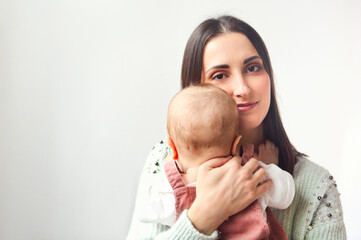 Happy mother with her little baby