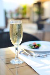 Close up of dinner with champagne outdoors