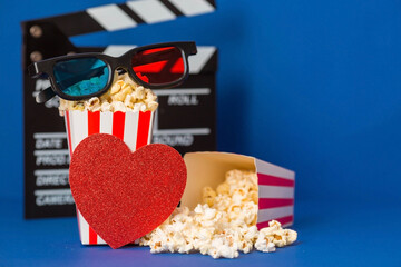 A banner for the film industry. A romantic movie date. A movie camera, 3D glasses, popcorn and red...