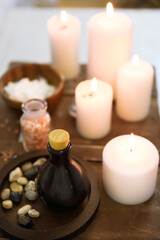 Obraz na płótnie Canvas Essential massage oil salt and candles at spa