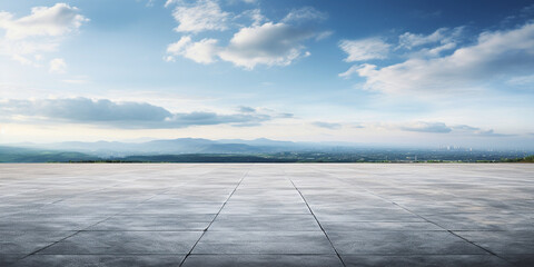 The horizon and the cloudy sky as a background, in the foreground an empty square. 