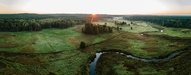 Sunrise among meadows and forests on the Suprasl River in Podlasie on an autumn,september day.