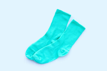 Green socks on white background.