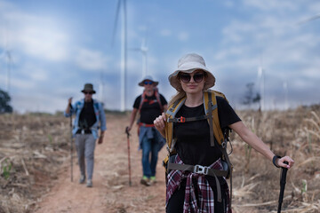 Happiness, joy of communication. Group of family, men and woman walking, strolling together during vacation, weekend in summer , meadow. Active lifestyle, friendship, resting concept.