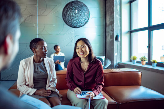 Business people discussing chart data in office