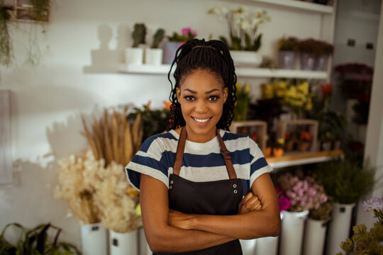 Portrait of a young african american female florist in flower shop