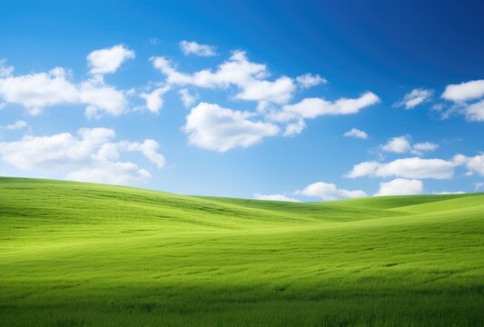 Rolling green hills beneath a brilliant blue sky adorned with fluffy clouds.