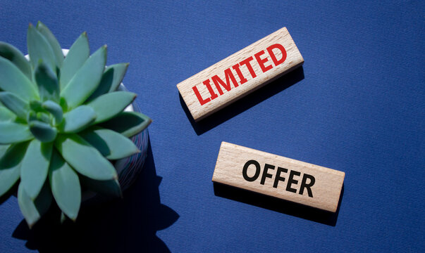Limited Offer symbol. Concept word Limited Offer on wooden blocks. Beautiful deep blue background with succulent plant. Business and Limited Offer concept. Copy space