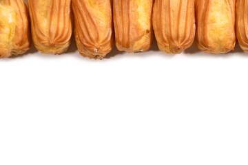 Sweet eclairs isolated on a white background.