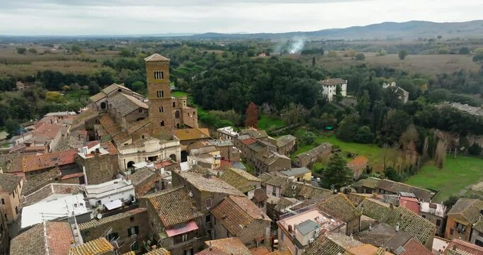 Historical Majesty: Aerial Perspectives on Sutri's Co-Cathedral and the Enchanting Cityscape Below. High quality 4k footage