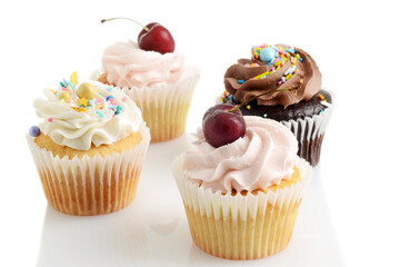 closeup of assorted buttercream cupcakes - 714859998