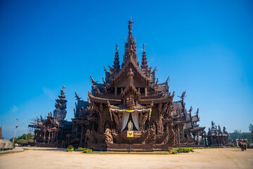 Fototapeta premium Sanctuary of Truth wooden temple in Pattaya Thailand is a gigantic wood construction located at the cape of Naklua Pattaya City. Sanctuary of Truth temple. 