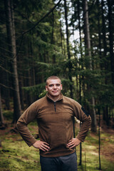 Going the distance. Shot of a young man enjoying a hike through the mountains. a handsome man with an athletic build is traveling in the mountains. landscape 
