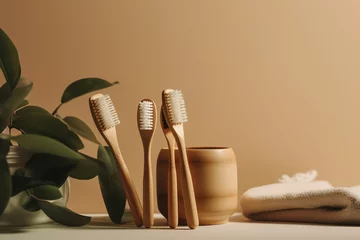 Poster Eco-friendly bamboo toothbrushes with plant and bathroom accessories on a beige background. © Rarity Asset Club