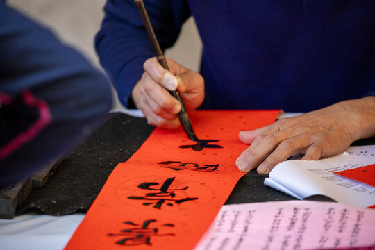 China, Spring Festival, calligrapher, handwritten Spring Festival couplets, brush characters, Chinese Spring Festival,