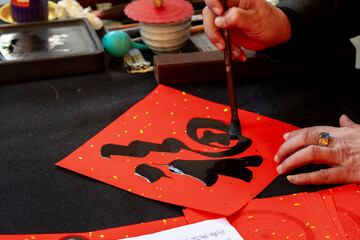 China, Spring Festival, calligrapher, handwritten Spring Festival couplets, brush characters,...