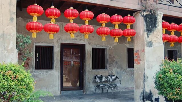 Red Chinese lanterns in the temple in China town, Bangkok. Translation: Happy Chinese New year