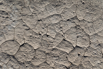 Abstract aerial top down view of cracked dry deserted surface of soil