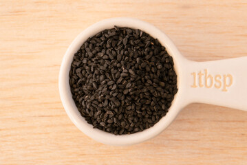 Black Charnushka Seeds in a Tablespoon