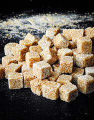 Brown sugar on dark background