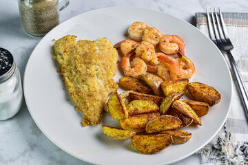 baked cod  with potato wedes and  sauteed shrimp, shrimp