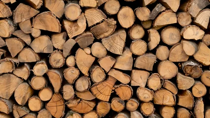 Fotobehang stack of firewood © alina