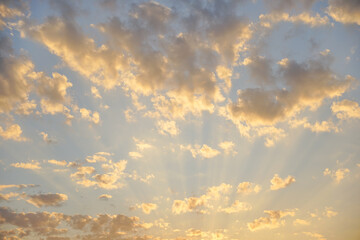 Sunlit Sky with White Clouds Background