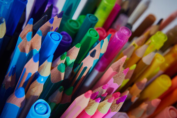 The tips of colored pencils and felt-tip pens. School supplies, materials for creativity and art....