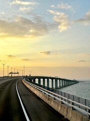 Fototapeta na wymiar the famous Hong kong-Zhuhai-Macau Brdige or HZMB, the longest bridge in the world spanning accross 50 km above and under the ocean. Taken during beautiful sunset.