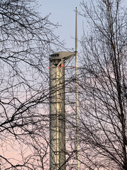 Glasgow science centre tower viewed through trees